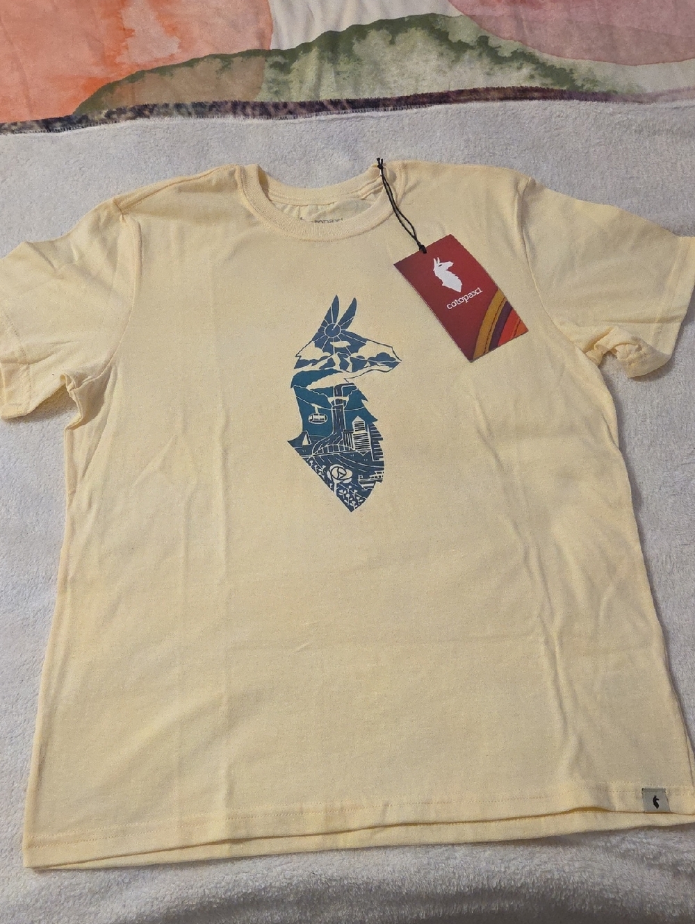 cotopaxi Pale Yellow Tee with Blue Llama Graphic